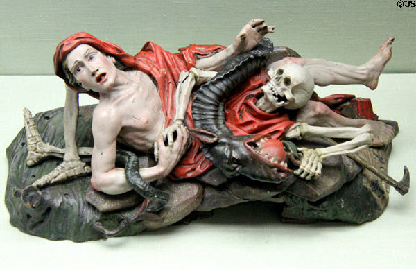 Allegorical ceramic sculpture of fall from grace, death & resurrection (c1750) probably from Saxony at Hamburg Decorative Arts Museum. Hamburg, Germany.