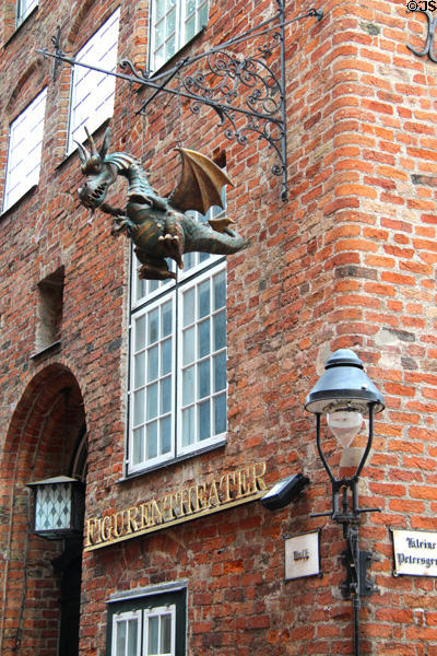 Dragon sign on Lübeck Museum of Theatre Puppets (Kolk straße). Lübeck, Germany.