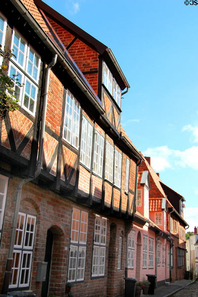 Half-timbered brick houses along narrow street. Lübeck, Germany.