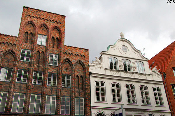 Buddenbrookhaus to right of typical brick stepped building of Lübeck. Lübeck, Germany.
