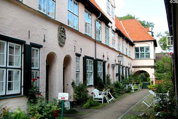Mini gardens of apartments at Füchtings Courtyard. Lübeck, Germany.