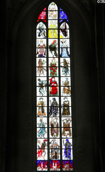 Modern stained glass window of nobles facing skeletons of death at St Mary's Church. Lübeck, Germany.