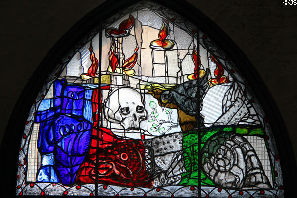 Modern stained glass window of skull at St Mary's Church. Lübeck, Germany.
