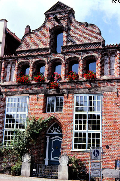 Brick building facing canal on Lünersstrasse. Lüneburg, Germany.