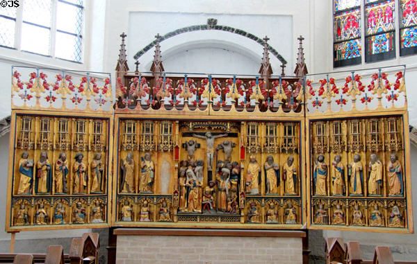 Altar with crucifixion flanked by Apostles & Saints at St. Mary's Church. Rostock, Germany.