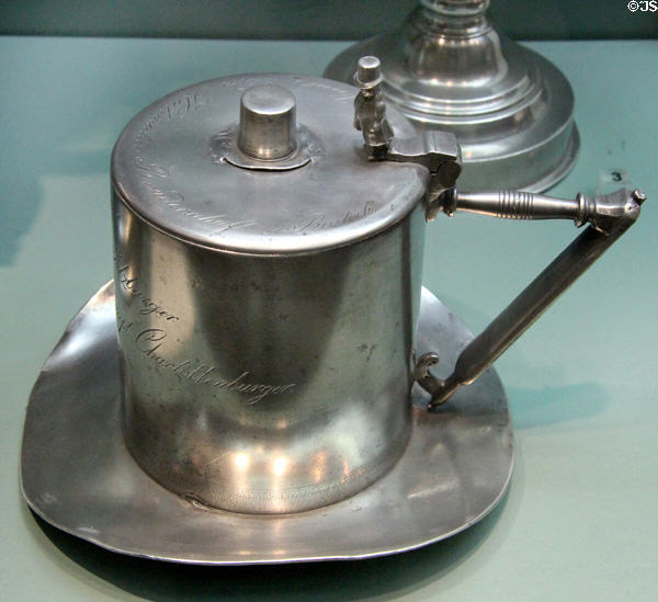 Hatter brotherhood pewter tankard (1853) by Peter G. Rahncke at Cultural History Museum. Rostock, Germany.