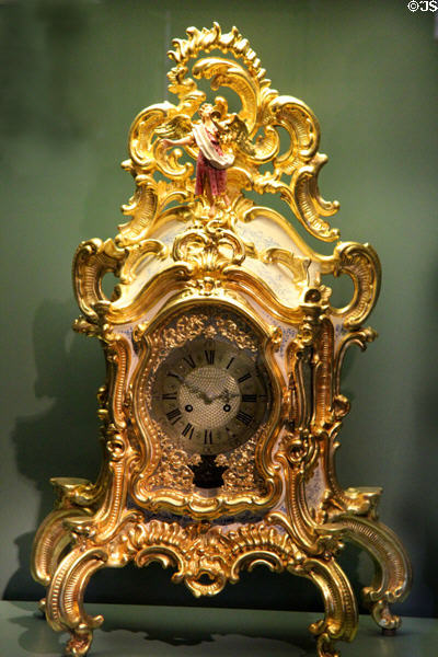 Rococo mantle clock with angel blowing trumpet (c1730) from Würzburg? at Cultural History Museum. Rostock, Germany.