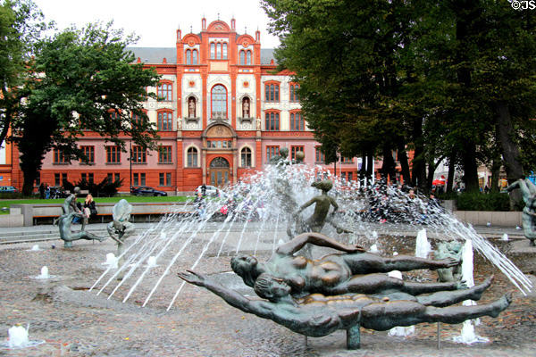 Joie de Vivre fountain (1985) by Jo Jastram & Reinhard Dietrich with Main building of University of Rostock beyond. Rostock, Germany.