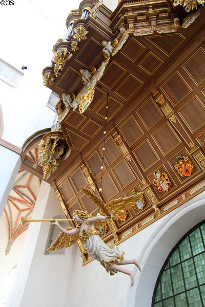 Carved angel with trumpet in Marienkirche (St. Mary's church). Stralsund, Germany.