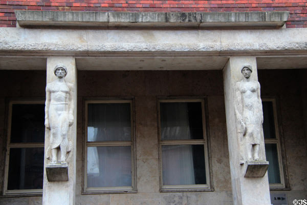 Socialist realist sculptures on House of Unions built during East German regime. Stralsund, Germany.