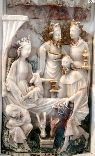Altarpiece fragment of Christ Child worshipped by Three Kings alabaster carving (c1390) at Schleswig Holstein State Museum. Schleswig, Germany.