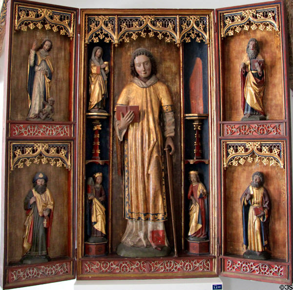 Gilded carved wooden winged altar with St. Lawrence surrounded by saints(1499) at Schleswig Holstein State Museum. Schleswig, Germany.