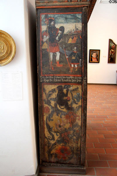 David & Goliath painting on side-panel of Renaissance-influenced Germanic cupboard (1576) at Schleswig Holstein State Museum. Schleswig, Germany.