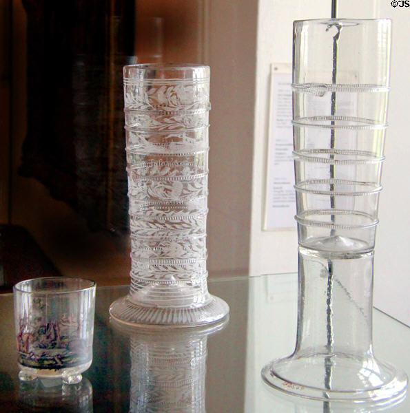 Two tall cylindrical German glass Paßgläser (17thC) with lines which marked volume of beer to drink at Schleswig Holstein State Museum. Schleswig, Germany.