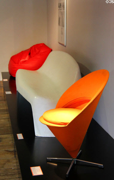 Modern 'Sacco' beanbag chair (1968) by Pierro Gatti, Cesare Paolini & Franco Teodore; plastic garden bench (1961) by Walter Papst; & Cone Chair (1958) by Verner Panton at Schleswig Holstein State Museum. Schleswig, Germany.