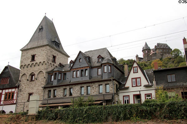Buildings facing Rhine River with Burg Stahleck (12C) on the hill. Bacharach, Germany.