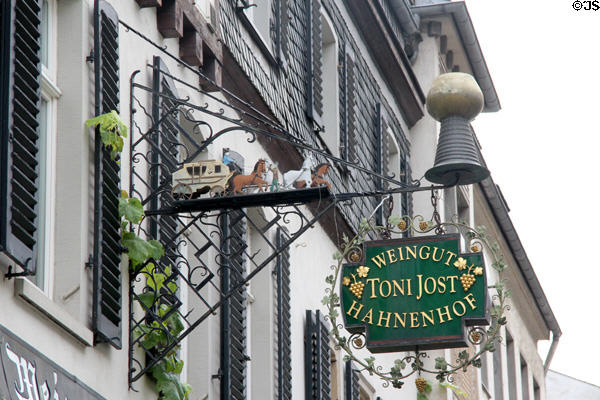 Wrought iron sign with stage coach on wine shop. Bacharach, Germany.