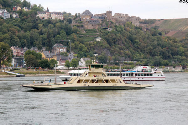 Rhine River traffic passing including car ferry St. Goar & Rheinfels Castle. St. Goar, Germany.