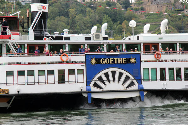 Goethe sightseeing boat passing in front of St. Goar with passengers enjoying the view. St. Goar, Germany.