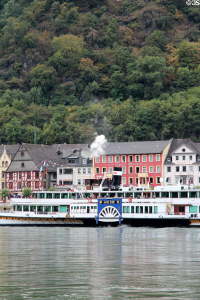 Sightseeing boat with St. Goar in the background. St. Goar, Germany.