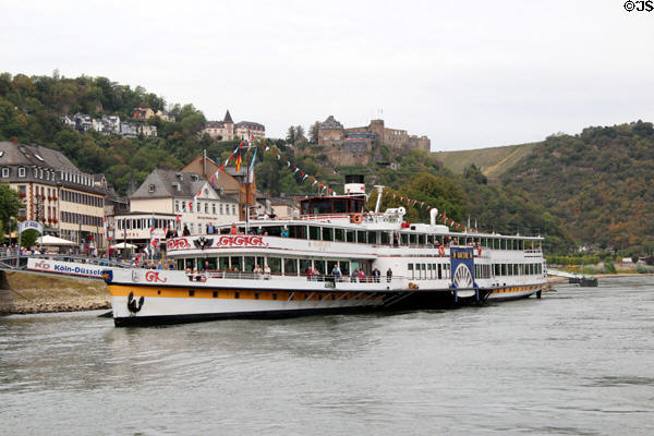 Sightseeing boat with Rheinfels Castle in the distance. St. Goar, Germany.