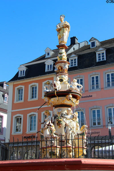 St Peter's Fountain (1595) with St Peter, Trier's patron saint, on top & statues representing the four cardinal virtues by Hans Rupprecht Hoffmann in Hauptmarkt. Trier, Germany.