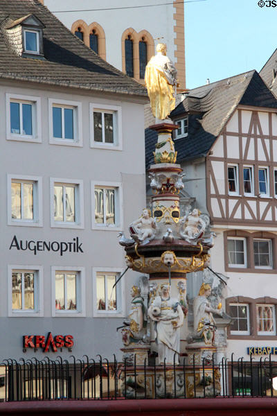 St. Peter's Fountain & Germanic residence facades in Hauptmarkt. Trier, Germany.