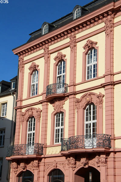 Building with baroque facade& wrought iron railings on Kornmarkt. Trier, Germany.