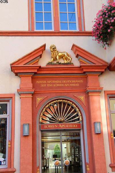 Ornate door surround for Lion Pharmacy (Löwen-Apotheke), family business since 1660 & reputed to be oldest pharmacy in Germany on Hauptmarkt. Trier, Germany.
