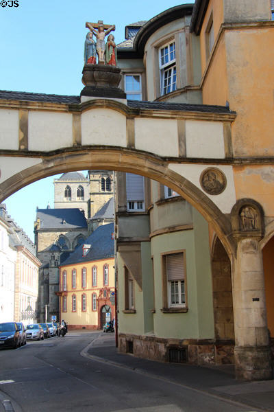 Historic archway over south end of Liebfrauenstr. looking toward Cathedral. Trier, Germany.