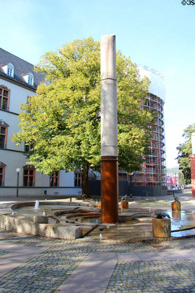 Water Clock Fountain (1984) with animal sculptures by Karl Jakob Schwalbach beside the Red Tower. Trier, Germany.