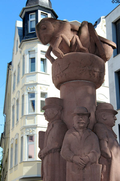 Figures on Grasshopper Fountain (1977), founding members of Carnival Society with giant grasshopper on top by Willi Hahn. Trier, Germany.