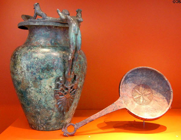 Etruscan pitcher with human figure handle & Etruscan sieve spoon (4thC BCE) at Trier Archaeological Museum. Trier, Germany.