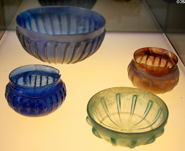 Roman ribbed glass bowls (1stC) in various shades at Trier Archaeological Museum. Trier, Germany.