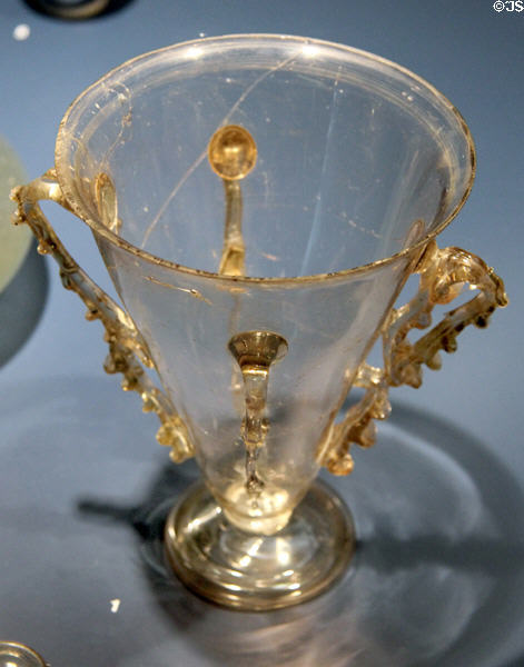 Roman glass chalice with four handles (4thC) found in Trier at Trier Archaeological Museum. Trier, Germany.
