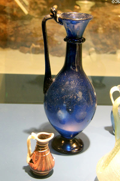 Roman glass pitchers with applied decoration (4thC) found in Trier at Trier Archaeological Museum. Trier, Germany.