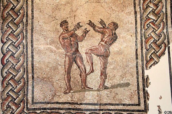 Fragment of Roman floor mosaic of two fighters in arena (early 4thC) at Trier Archaeological Museum. Trier, Germany.