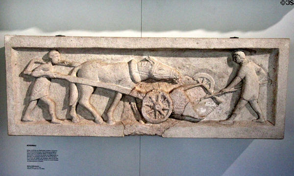 Roman carved relief (2ndC) of horse pushing a mowing machine for harvesting grain at Trier Archaeological Museum. Trier, Germany.