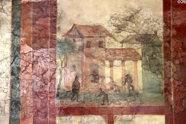 Wall painting of typical Roman house with arcade plus local dress on figures including hooded coat (2ndC) at Trier Archaeological Museum. Trier, Germany.