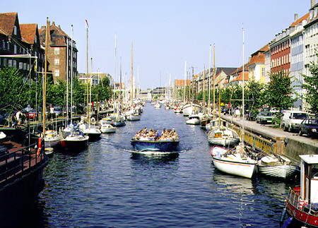 Boating a canal near the Church of the Redeemer in Kobenhavn. Denmark.