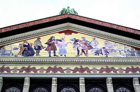 Devil overlooks the mural on the face of the theatre in Århus. Denmark.