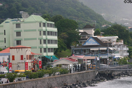 Colorful buildings nestled against hills. Roseau, Dominica.
