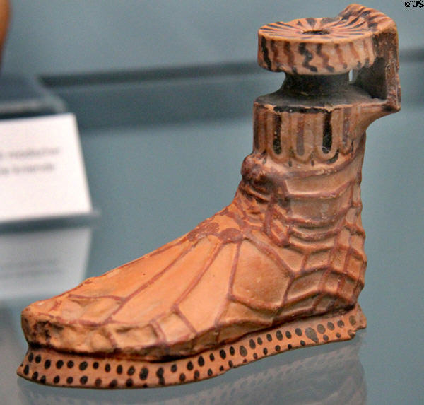 Greek terracotta vessel in shape of sandaled foot (c575-550 BCE) from Rhodes at Antikensammlungen. Munich, Germany.