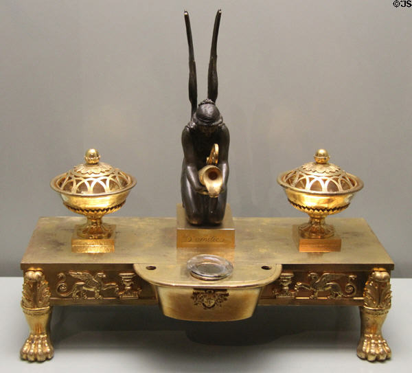 Bronze desk set of King Max I Joseph with sculpted female figure pouring liquid into inkwell between two blotting sand containers (c1810) prob. from Paris at Bavarian National Museum. Munich, Germany.
