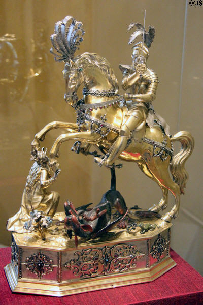 Gilded silver drinking game in form of St George Dragonslayer (c1615) by Jakob I Miller from Augsburg at Bavarian National Museum. (The base contains a wind-up mechanism to roll this centerpiece across the table. The diner closest to where it stopped had to open the head & drink the wine inside.). Munich, Germany.
