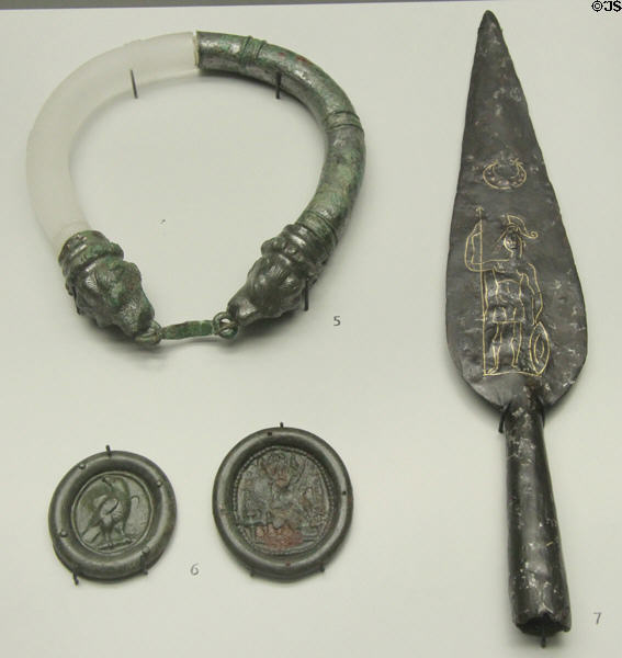 Roman military honors in form of metal ring & coins plus an iron spear with image of Mars for tip of standard found near Ansbach & Kelheim at Bavarian State Archaeological Collection. Munich, Germany.