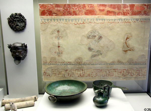 Roman-era wall painting (1stC) from Kempten plus bronze masks & vessels plus white sections of lead pipe at Bavarian State Archaeological Collection. Munich, Germany.