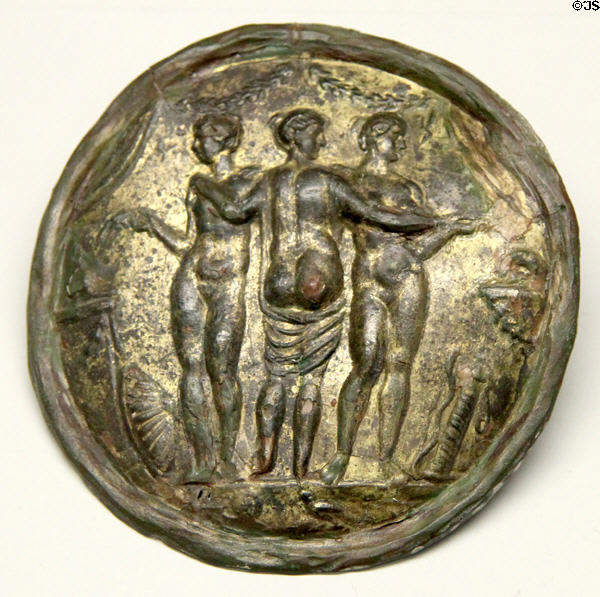 Gilded mirror back with relief of three graces (2ndC) found near Eichstätt at Bavarian State Archaeological Collection. Munich, Germany.