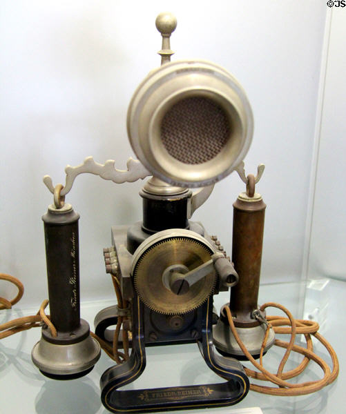 Desktop telephone with two earphones & hand generator crank (1899) at Deutsches Museum. Munich, Germany.