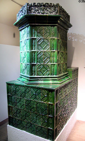 Tiled stove (17thC) with green lead glazed earthenware tiles made for Castle Haneberg in Thurgau, Switzerland at Deutsches Museum. Munich, Germany.